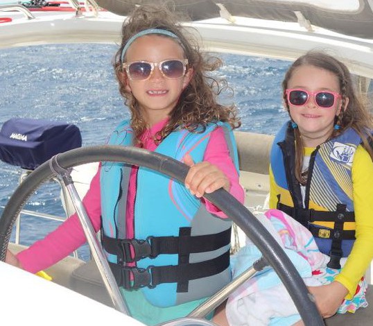 Anna (left) and her best bud sailing the big cat.  (Photo credit:  Laura Ward)